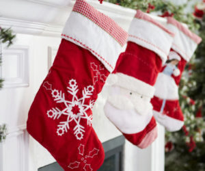 Empty Stockings Hung On Fireplace On Christmas Eve
